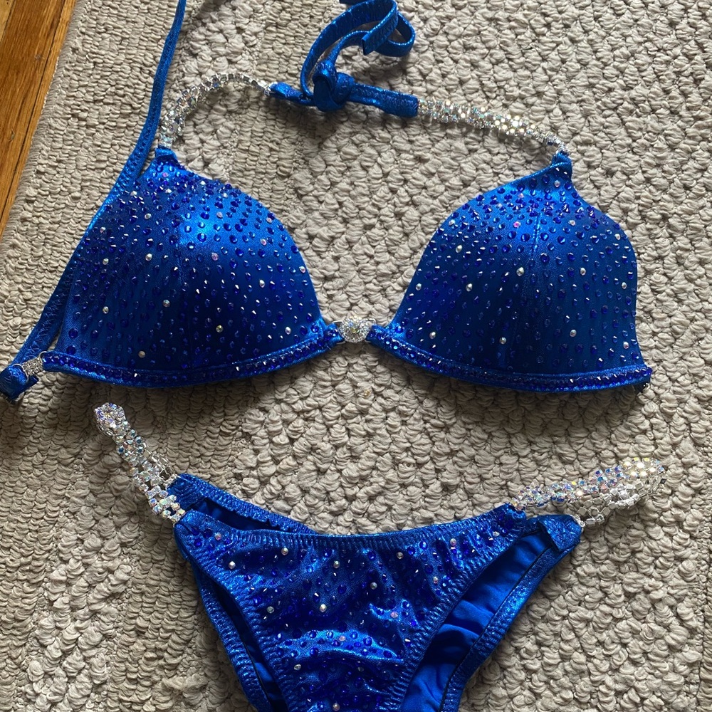 NPC bikini suit never worn. In perfect condition. Top is a B cup & small bottoms